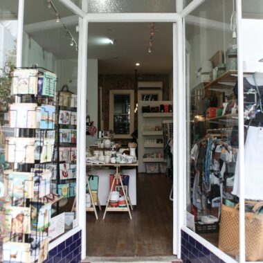 Elegant boutique entrance showcasing diverse merchandise for a unique shopping experience.