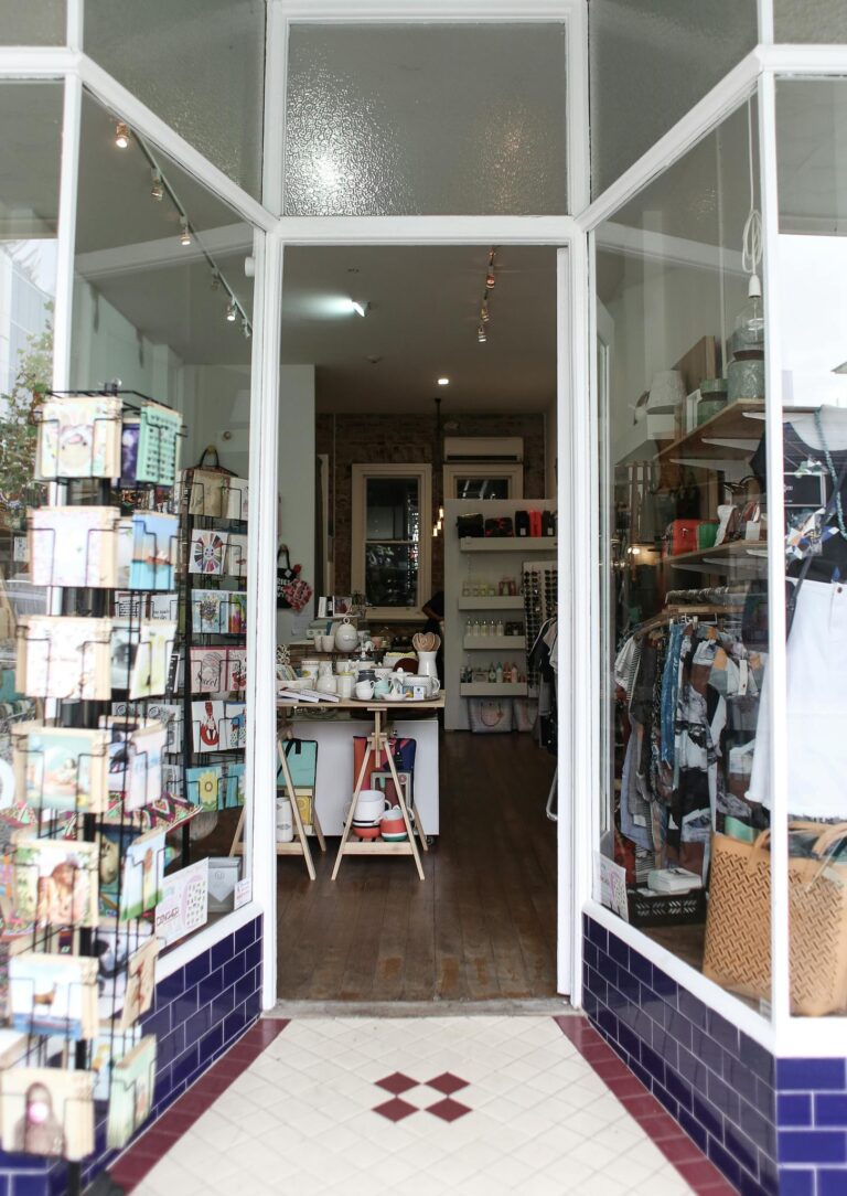 Elegant boutique entrance showcasing diverse merchandise for a unique shopping experience.