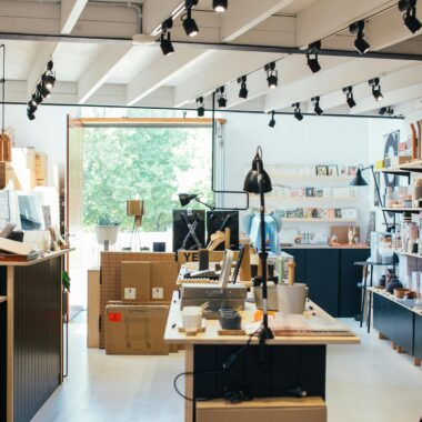 Trendy store interior featuring a female customer browsing surrounded by chic decor.